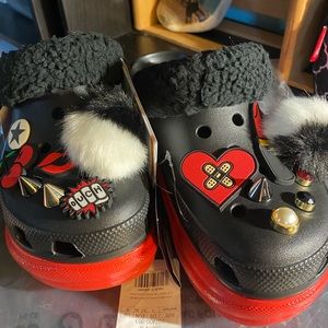 red bottom bae Cruella Crocs collab.